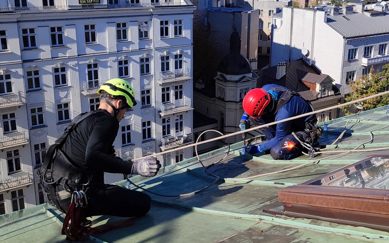 Rope access team working on a high roof